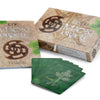 The Māori Oracle by Schiffer Publishing, Ltd. includes a guidebook and Maori-designed box, with green illustrated cards fanned out—offering ancestral guidance and celebrating New Zealand spirituality.