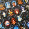A spread of colorful Higher Self Oracle cards by Schiffer Publishing, Ltd., featuring mystical art and guidance words like “Acceptance,” “Strength,” “Anger,” “Patience,” and “Transformation.”.