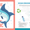 A cheerful cartoon swordfish grins as it swims alongside an ocean conservation-themed crossword puzzle, decorated with a recycling symbol, bottle, coral, and bubbles—ideal for fans of ocean-themed puzzles. The Schiffer Publishing, Ltd. KindKids Awesome Ocean Adventure Puzzle Book features the uplifting message: “You’re FIN-TASTIC!”.