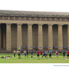 People play volleyball on a grass field in front of the full-scale Parthenon replica, featured in the Nashville book by Schiffer Publishing, Ltd.