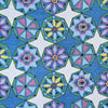 Terry Cloth by Schiffer Publishing, Ltd. features geometric hexagons and star-shaped floral patterns in blue, green, yellow, pink, and white on a blue background, with “Florals & Geometrics” displayed on the right side.