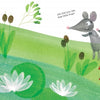In "Lili's Colors" by Schiffer Publishing, Ltd., two mice on green grass by a pond with white lilies spot a small green frog. One mouse points excitedly while the other looks puzzled among the bright, cheerful lily pad scene.