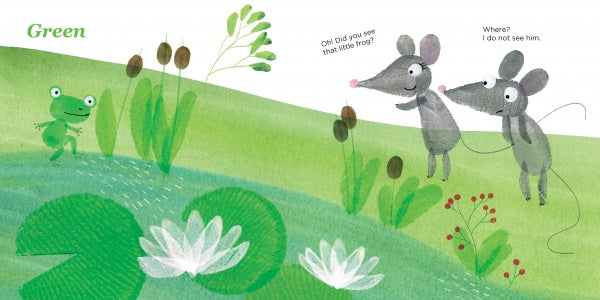 In "Lili's Colors" by Schiffer Publishing, Ltd., two mice on green grass by a pond with white lilies spot a small green frog. One mouse points excitedly while the other looks puzzled among the bright, cheerful lily pad scene.
