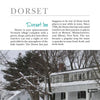 A snowy white inn with a “Dorset Inn” sign stands among winter trees in Dorset, Vermont, featured in Haunted Vermont by Schiffer Publishing, Ltd., which explores the inn’s charm and eerie tales from its storied past.