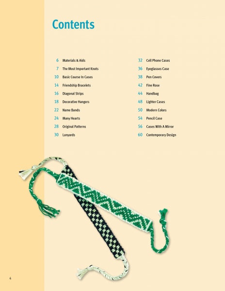 Two woven friendship bracelets with green, white, and black geometric patterns are displayed on light yellow beside Schiffer Publishing, Ltd.’s craft book "Knot Design"—a must-have for anyone interested in knot projects.