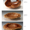 Turning Natural Edge Bowls by Schiffer Publishing, Ltd. features three wooden bowls: a round bowl with a jagged rim on top, two flat wavy-edged bowls below, all displaying unique grain patterns and polished finishes against a white background.