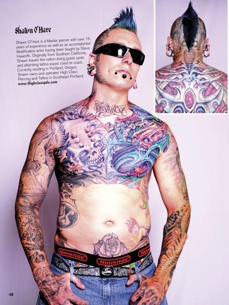 A tattooed man, captured in striking detail, showcases the artistry featured in Justice Howard’s photography book "Revelations" by Schiffer Publishing, Ltd.