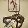 The Lenormand Oracle Cards by Schiffer Publishing, Ltd. feature a 7 of clubs with vintage art: a woman above a coiled snake on a branch. The number 7 appears in circles in both top corners—ideal for card collectors.