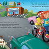 An illustration from "Bicycling Rules of the Road" by Schiffer Publishing, Ltd. shows two kids riding a bike together near parked cars, following safety rules, as a happy dog runs alongside. The background features colorful buildings, trees, and a hardware store.
