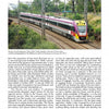 A V/Line Vlocity train with purple, yellow, and silver colors moves through a green landscape beneath overhead wires, as seen in "Fast Trains Worldwide" from Schiffer Publishing, Ltd., showcasing modern railway evolution amid trees and signals.
