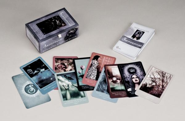The Inspirations for Survivors oracle card set by Schiffer Publishing, Ltd. is displayed with its box, guidebook, and illustrated cards featuring dreamlike art—an ideal tool for healing and guidance for survivors.