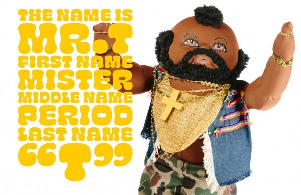A doll with a mohawk, gold chains, and a denim vest raises its arms—modern folk art featured in "I Pity the Dolls" by Schiffer Publishing, Ltd. Yellow text: The name is MR. T. First name Mister. Middle name Period. Last name T.