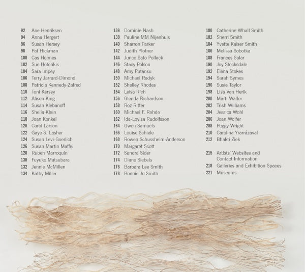 On the cover of Artistry in Fiber, Vol. 1 by Schiffer Publishing, Ltd., black names and numbers on white appear above a layer of light beige, textured fibers, evoking contemporary fiber art and delicate techniques at the bottom.
