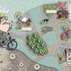 Storybook page from "Shoes, Little Shoes, Big Shoes" by Schiffer Publishing, Ltd., features a mustachioed ogre with glasses cycling through a whimsical village map with houses, trees, signposts, and narrative text.