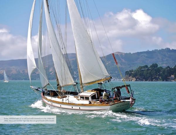 The book "Great American Schooner Yachts" by Schiffer Publishing, Ltd. showcases classic schooners sailing on vibrant blue-green waters under full sail, framed by hills, trees, and sky with other yachts in the distance.