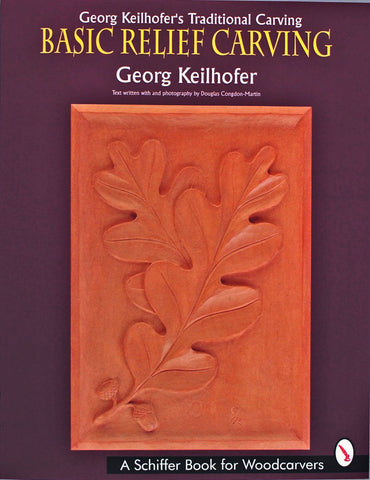 Book cover for Georg Keilhofer's Traditional Carving by Schiffer Publishing features a carved wooden panel with oak leaves and acorns against a dark background, highlighting German woodcarving techniques.